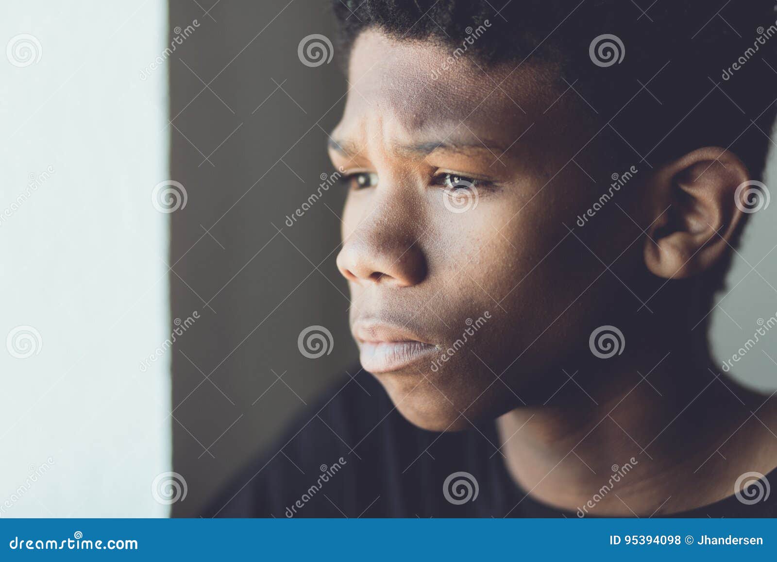 faded retro portrait of a worried african boy