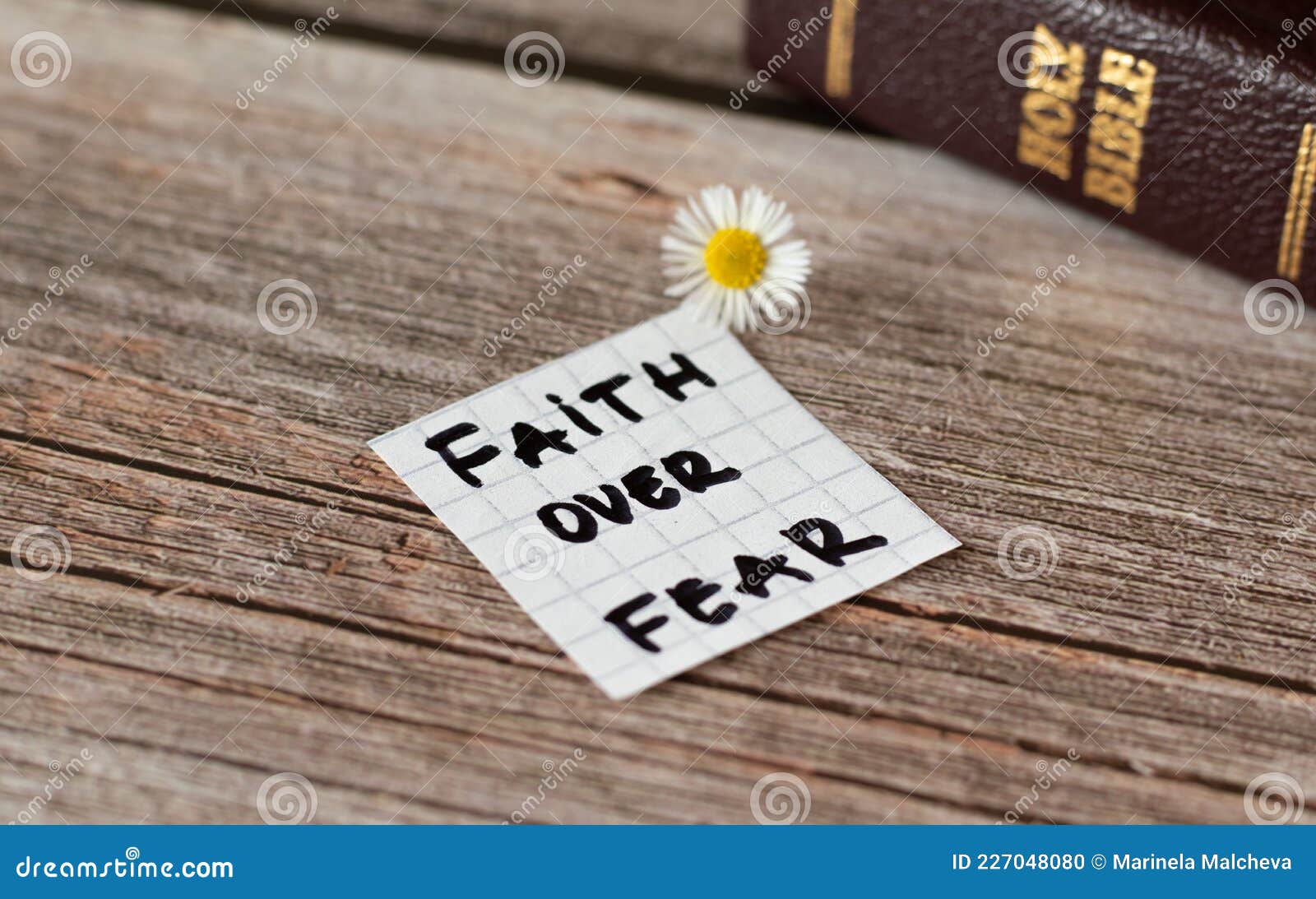 Faith Over Fear. Inspiring Handwritten Quote from the Bible Book Stock