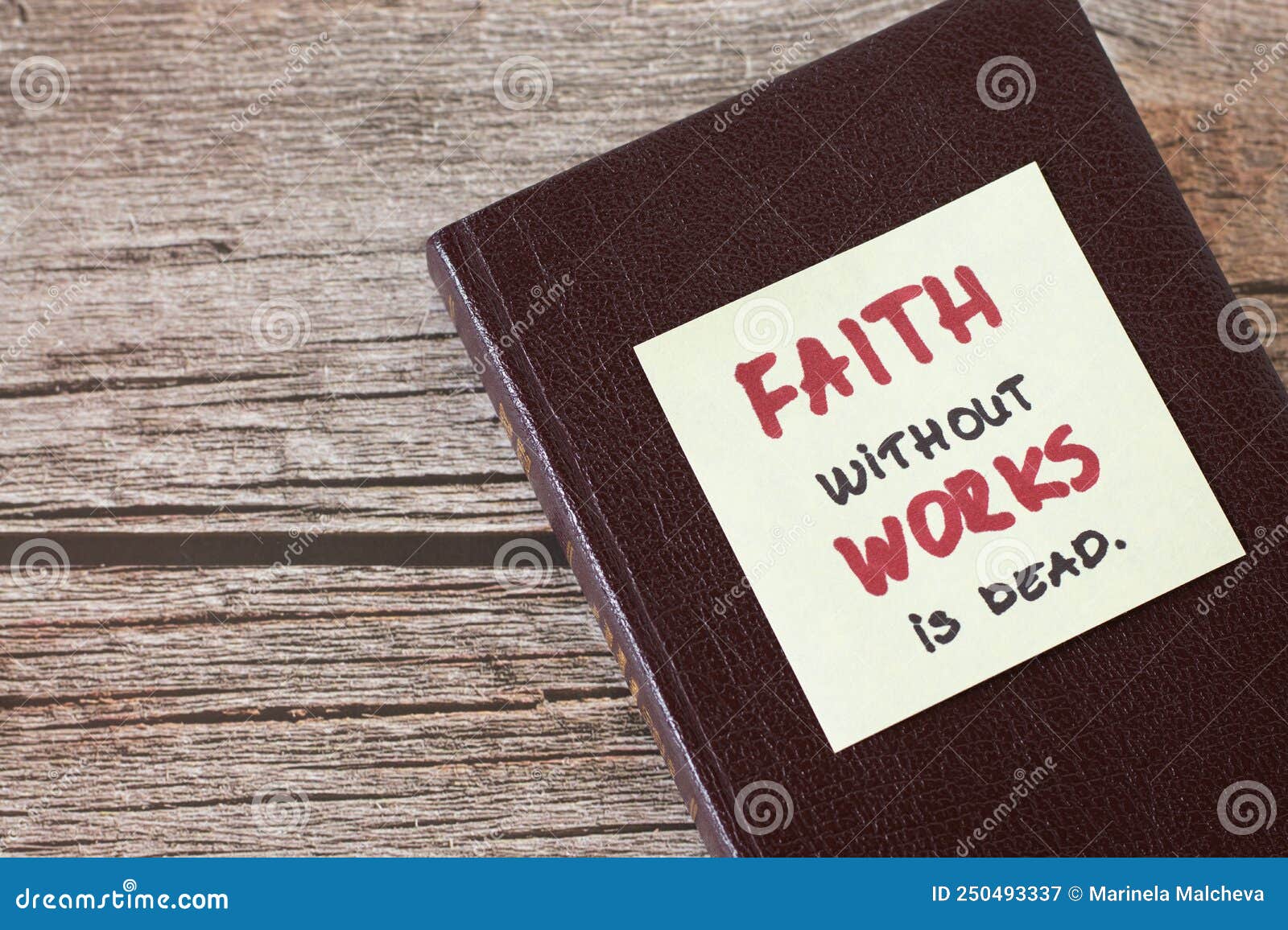 faith without works is dead, a handwritten quote on a note on top of a closed christian holy bible book