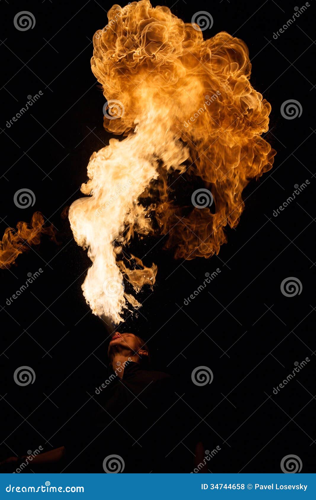 fakir breathes spurts of flame