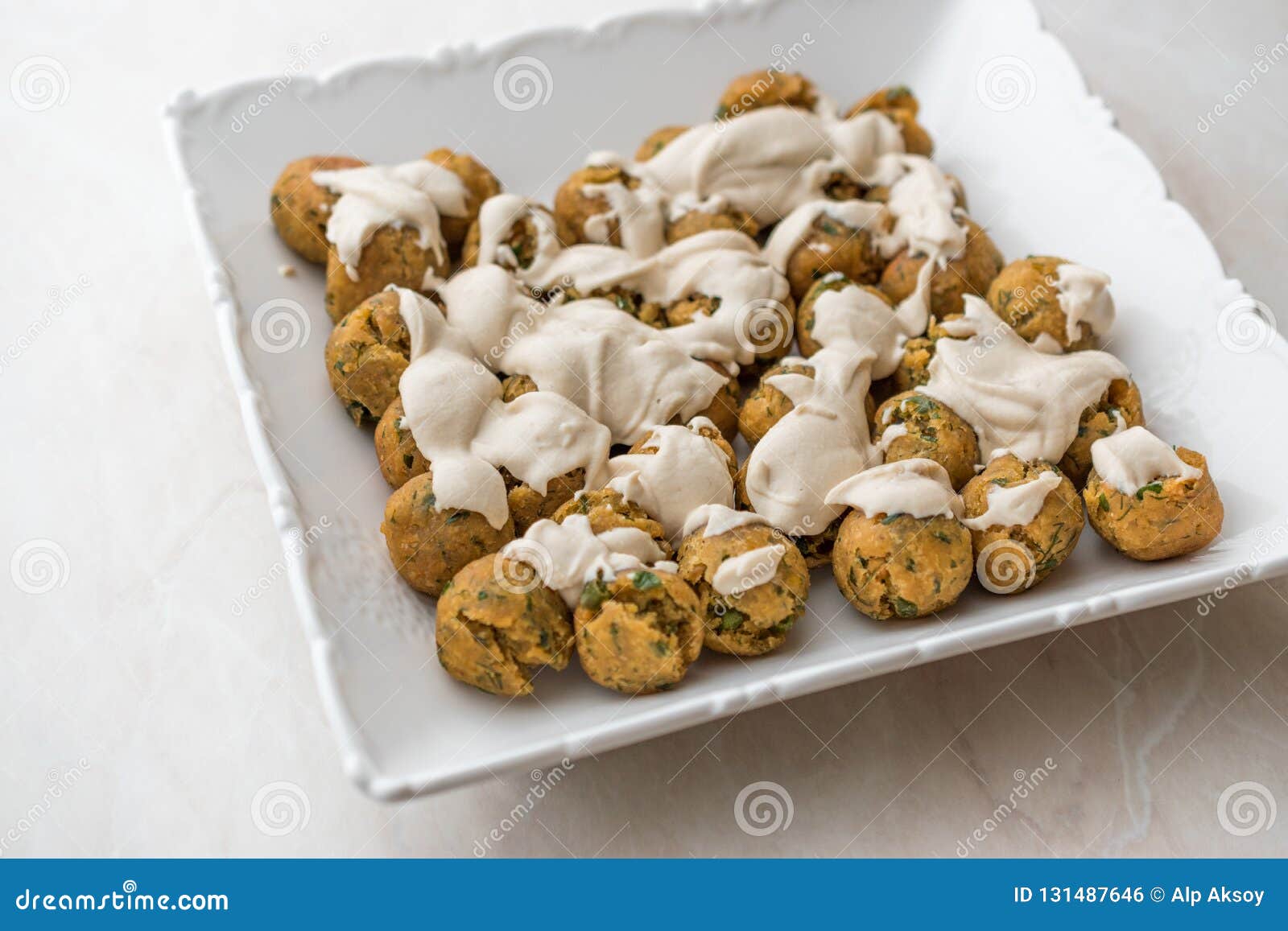 Falafel Balls with Hummus Sauce in Rectangular Plate. Stock Photo