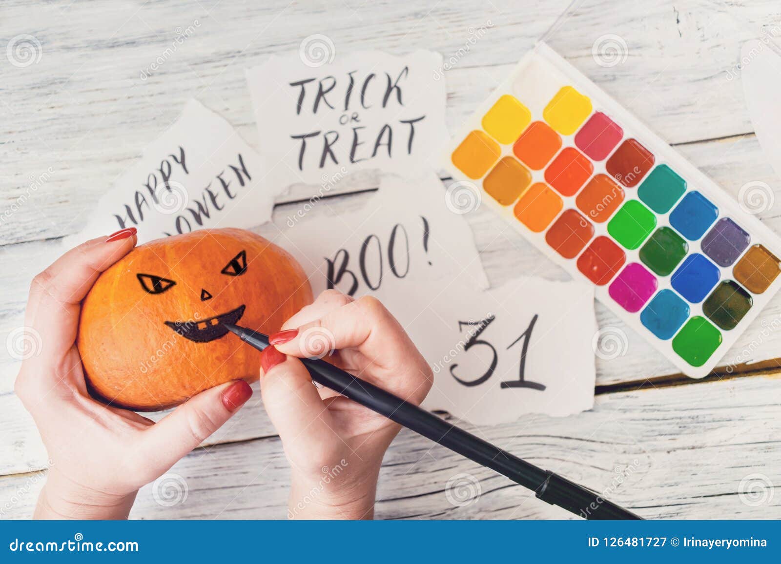 Fall Halloween Crafts. Female Hands Draw Jack Oâ€™ Lanterns on O Stock ...