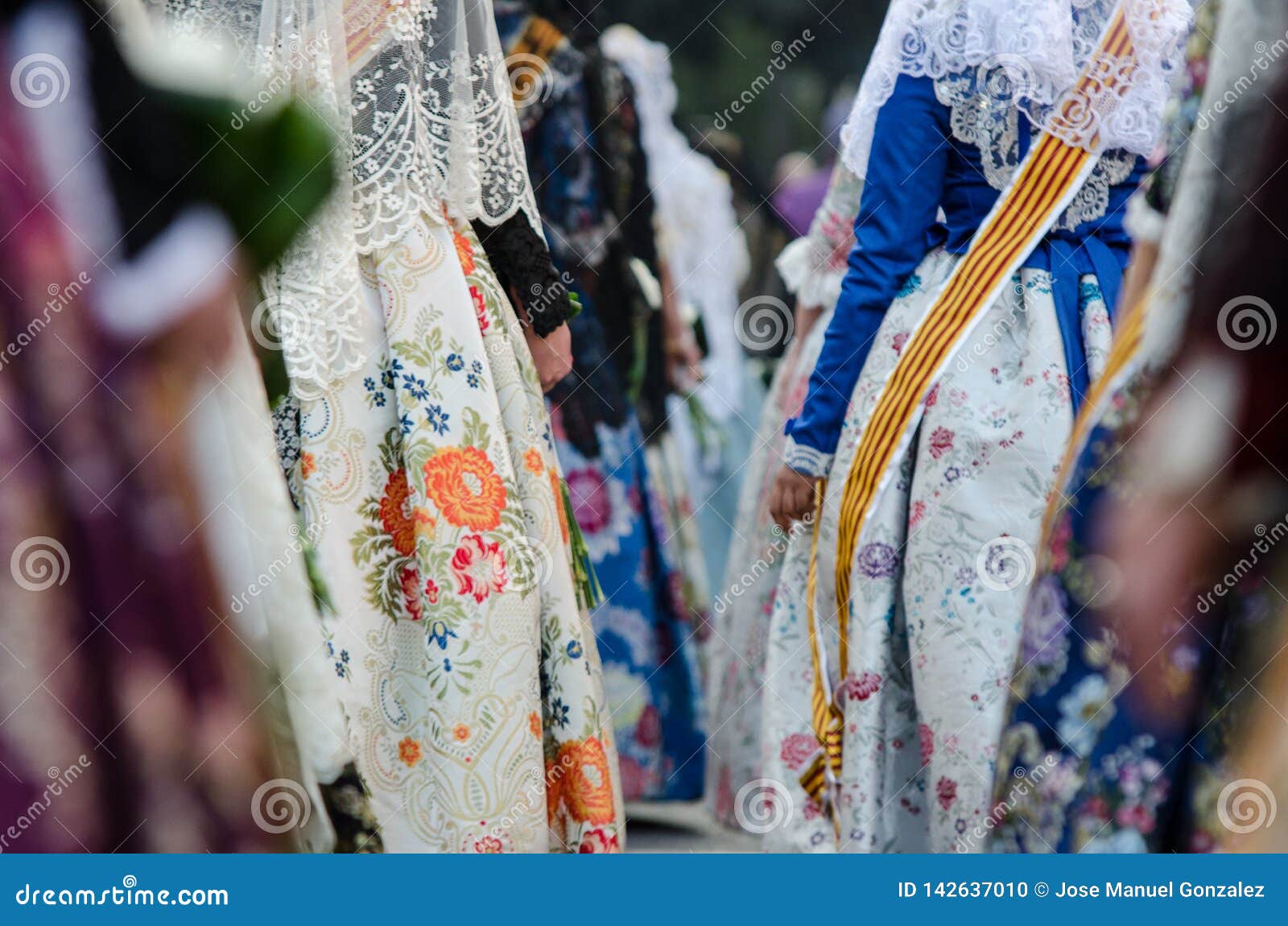 falleras dress traditional with flowers, spain, valencia. fashion fallas festival in valencia