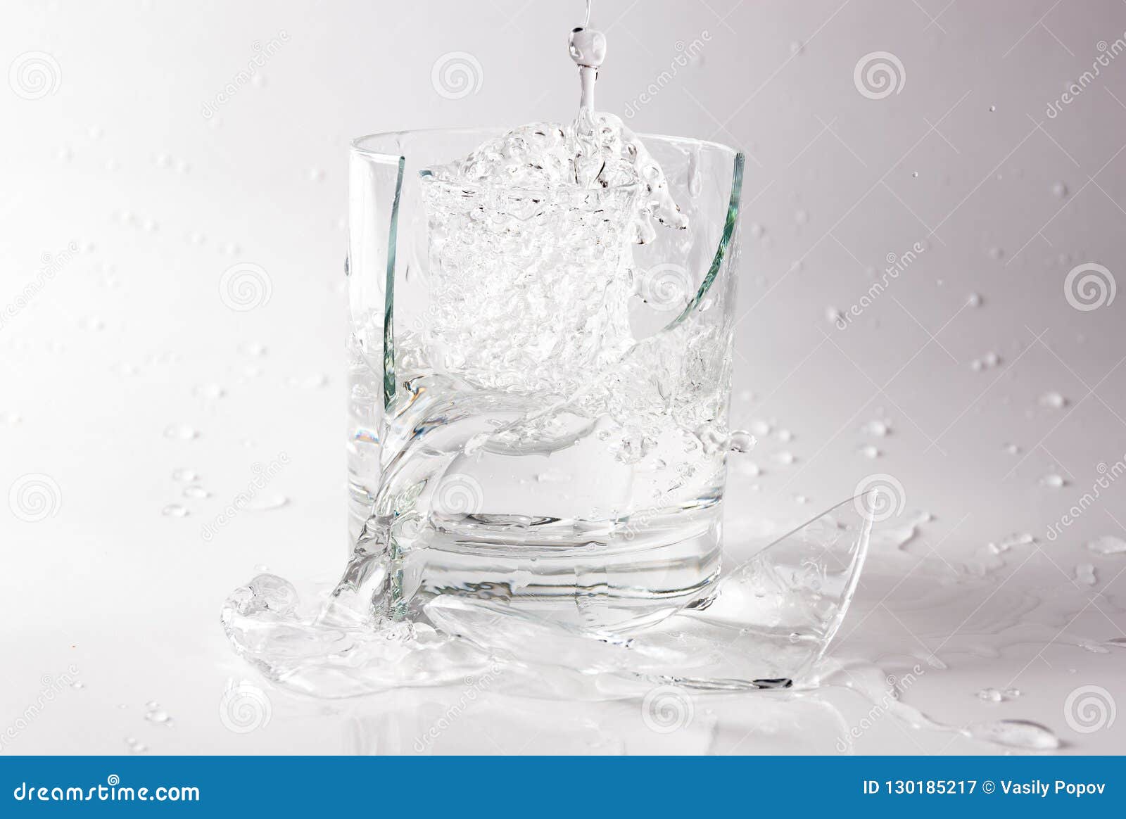 Falling and Crashing Glass of Water. Shards of Glass and Splashing Water Stock Image Image of