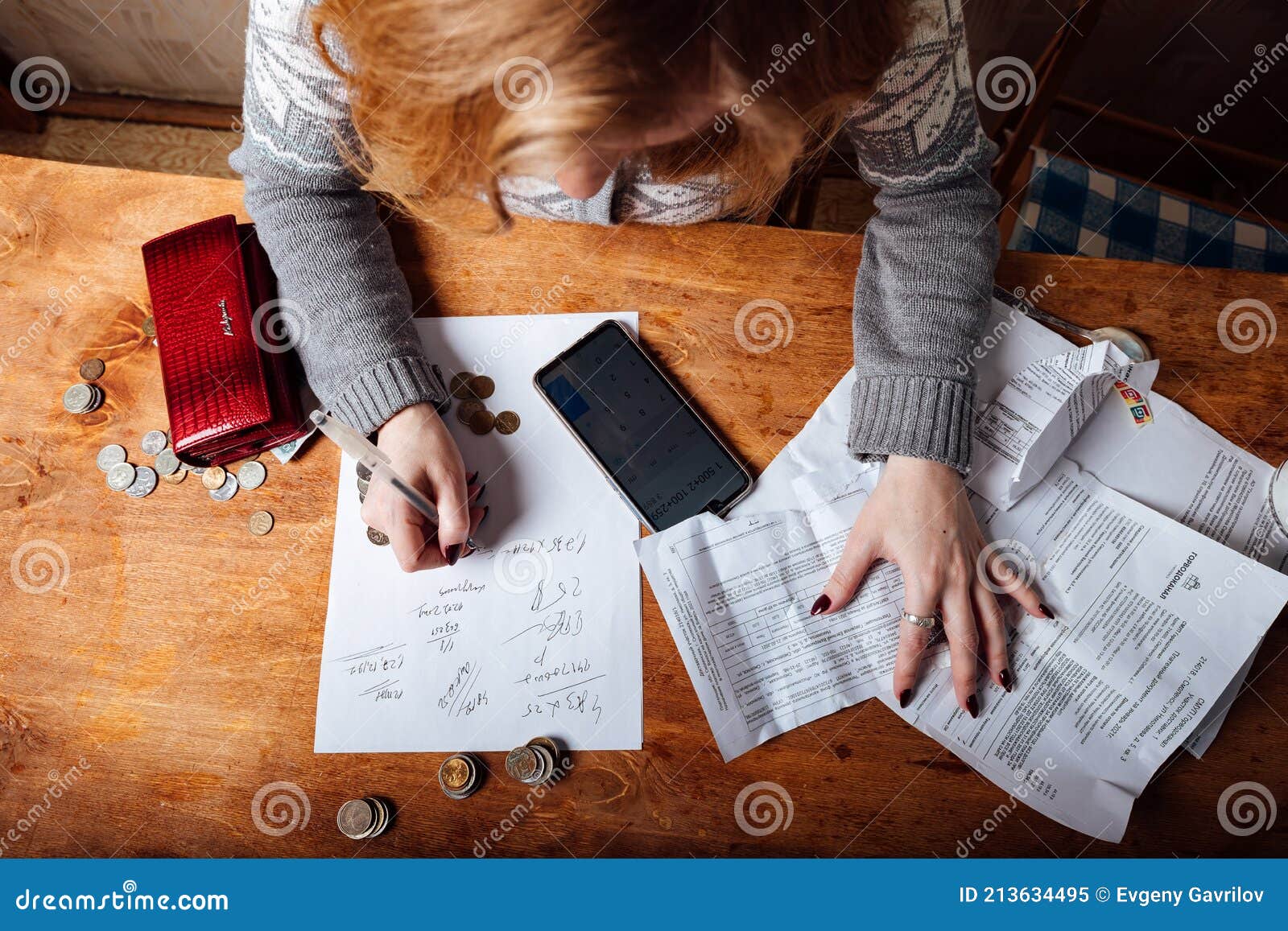 the-girl-calculates-taxes-and-fills-out-the-documents-on-the-bills