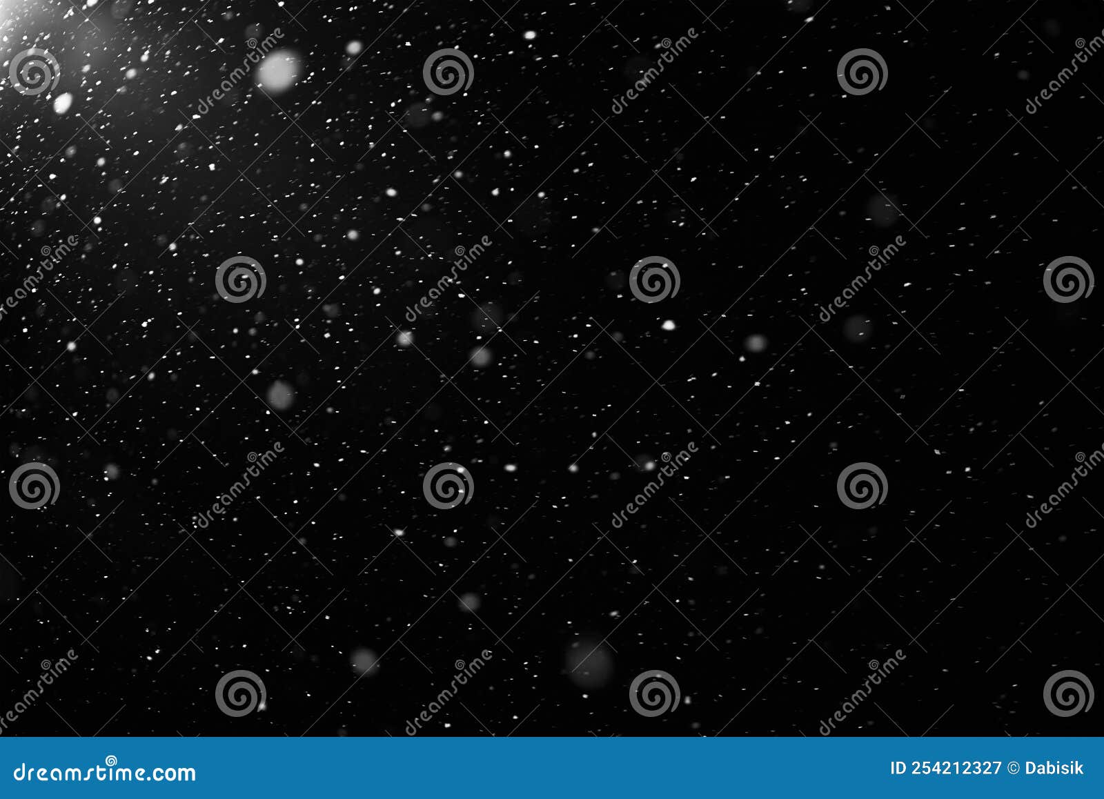 Snowflakes falling down on black background, heavy snow flakes