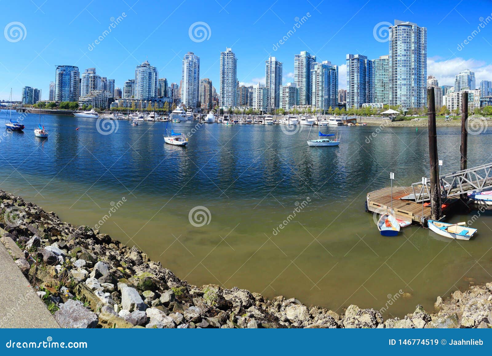 vancouver skyline across false creek from spyglass dock, british columbia, canada