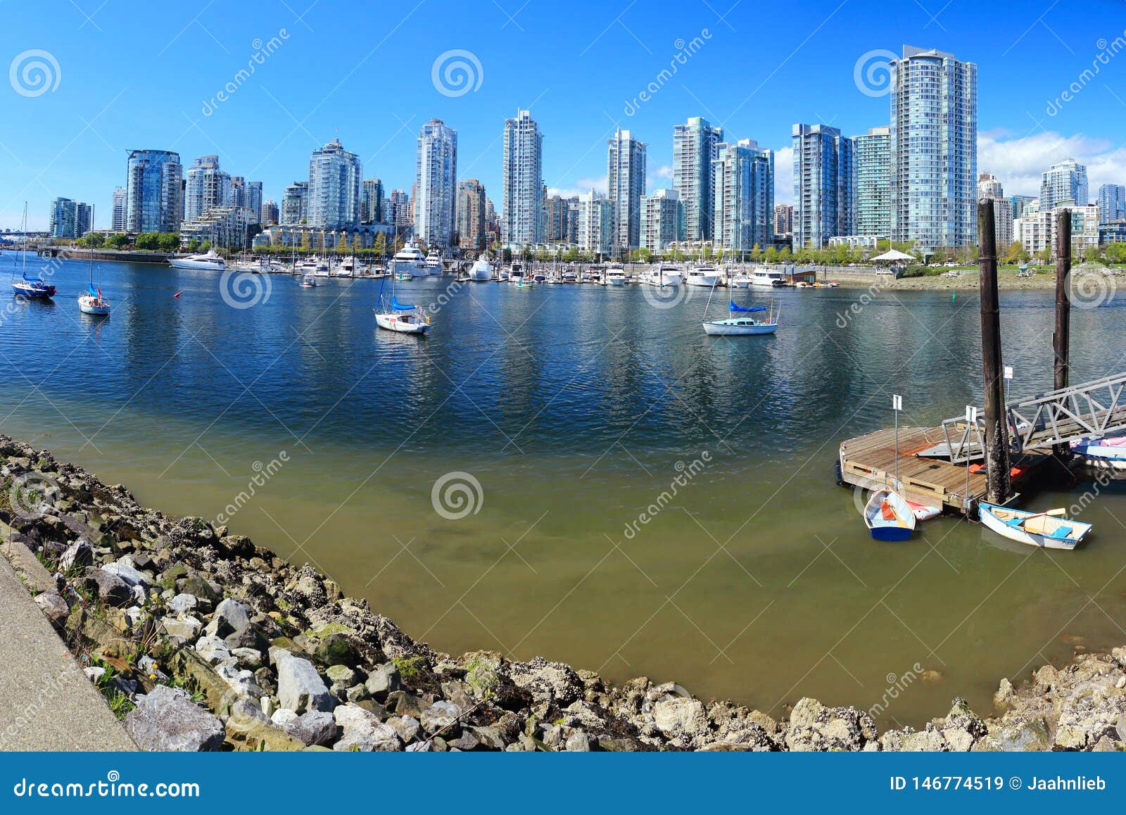 vancouver skyline across false creek from spyglass dock, british columbia, canada