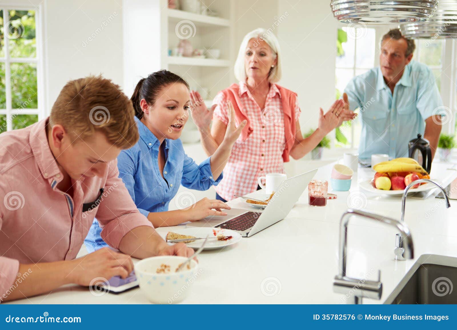 family with adult children having argument at breakfast