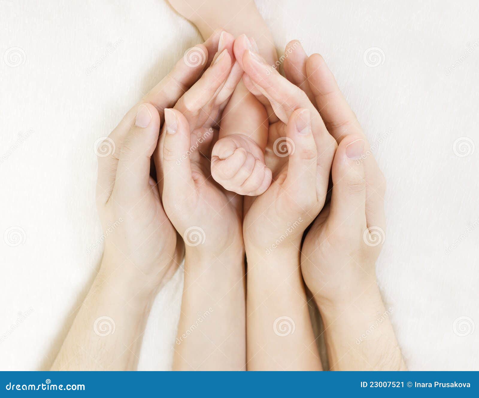 family baby hands, newborn kid hand into mother father parents hands