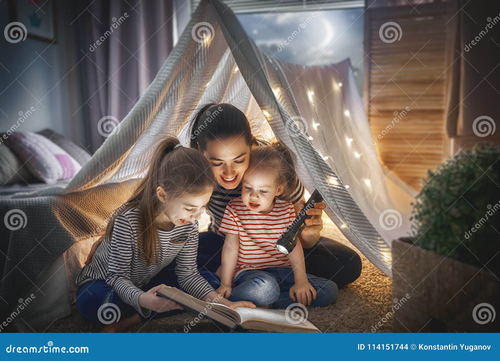mom and children reading book