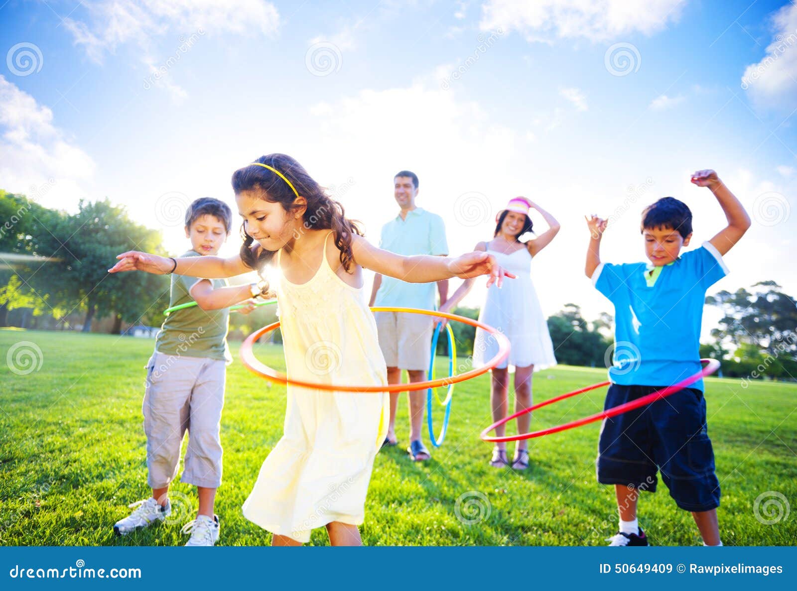 Family Bonding in the Park stock image. Image of hoop 50649409