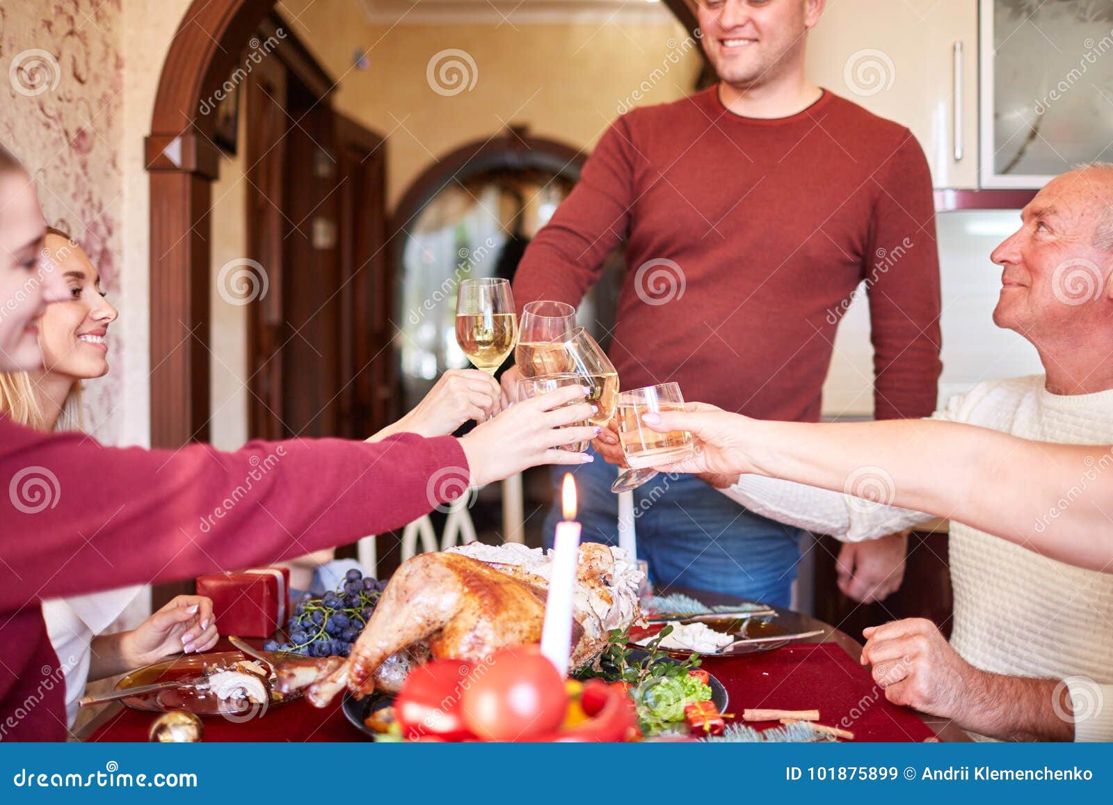Family Cheering and Drinking on Thanksgiving on a Blurred Background photo