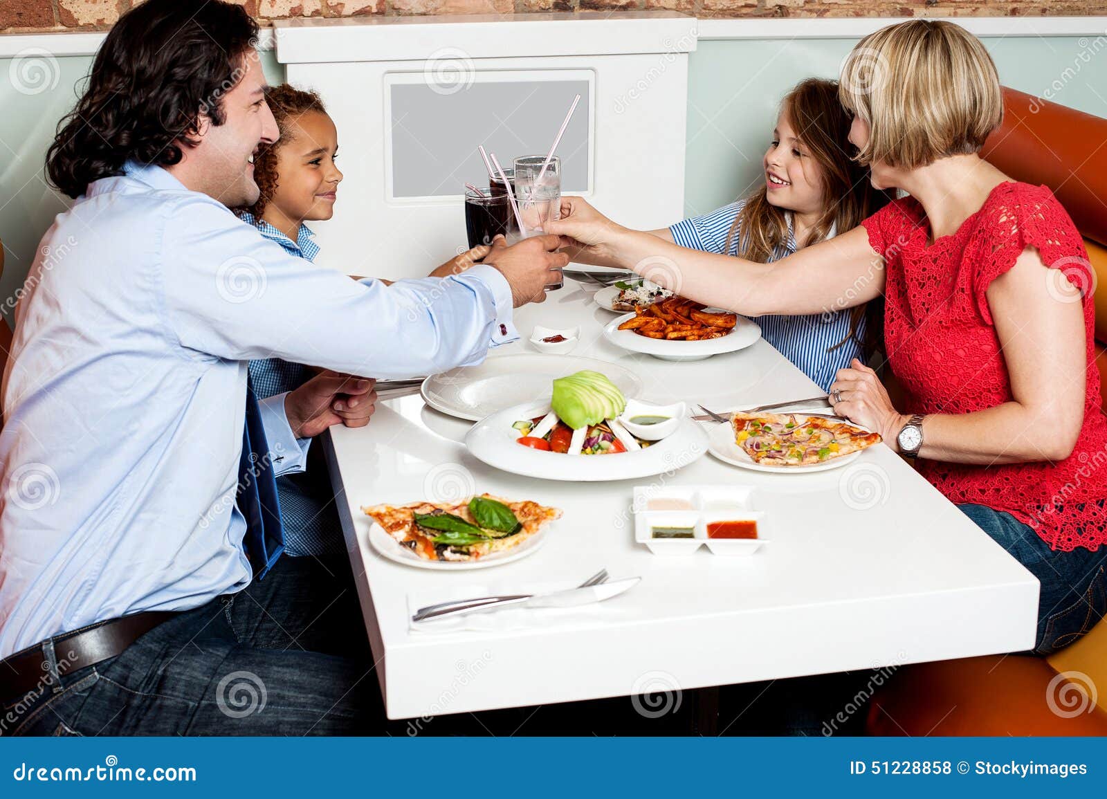 Family Dinner at Restaurant Stock Photo - Image of father, parents