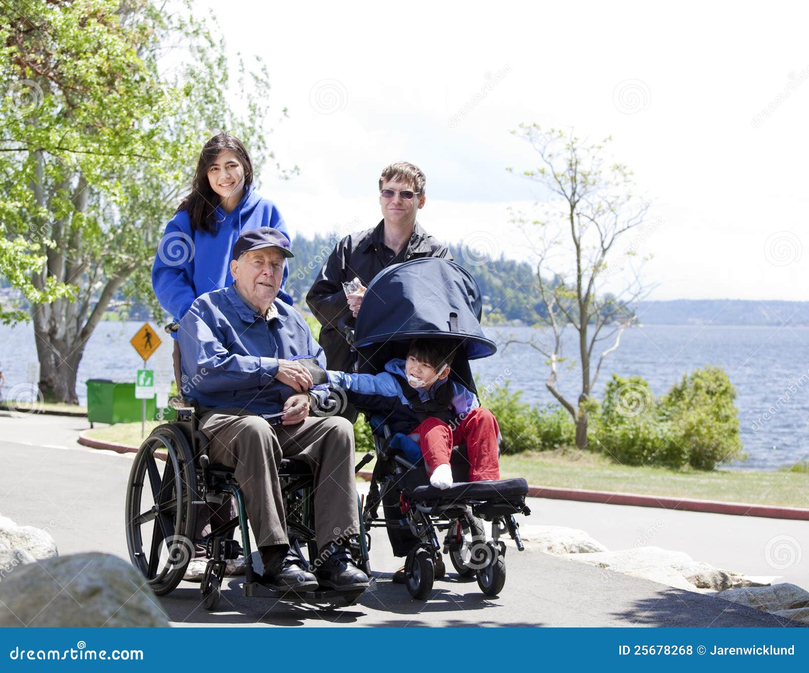Family with Disabled Senior and Child Outdoors Stock Photo Image of