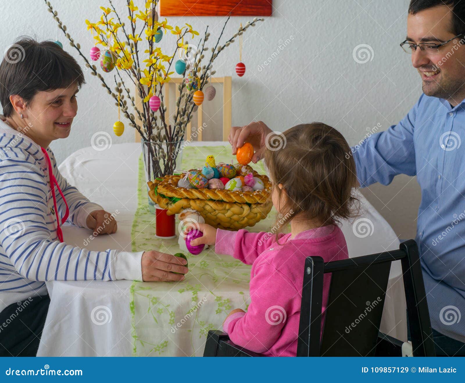 family at easter picking eggs