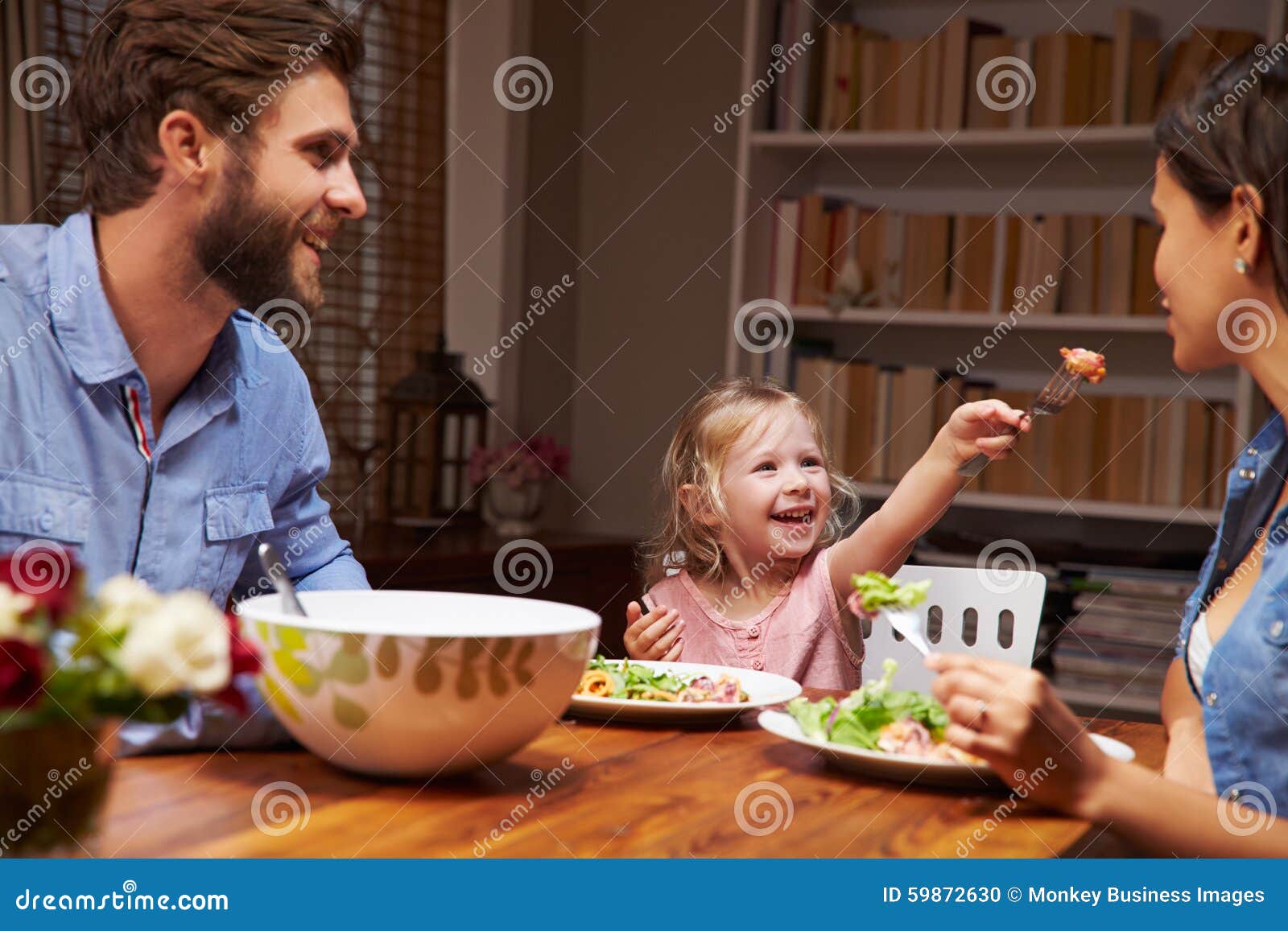 family eating an dinner at a dining table