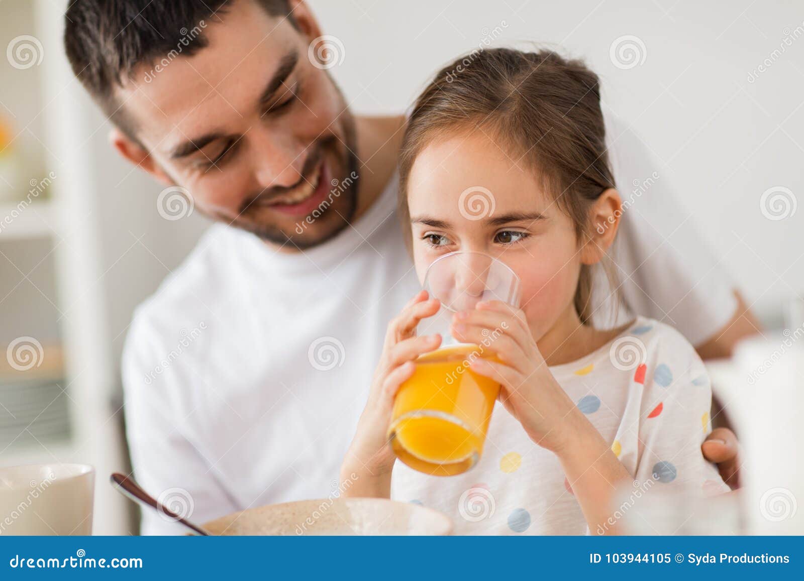 Download Happy Girl With Father Drinking Juice At Home Stock Image ...