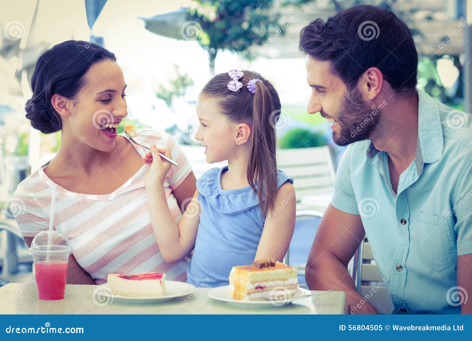 A Family Eating at the Restaurant Stock Image - Image of people