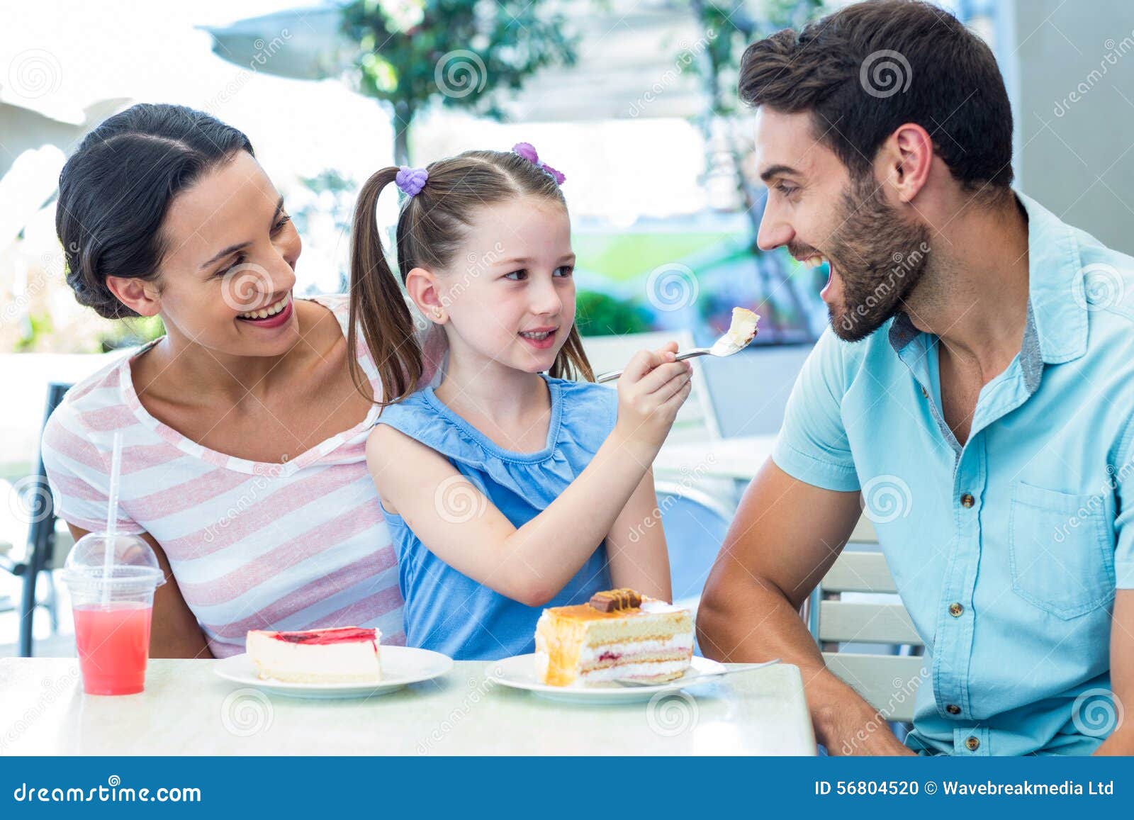 A Family Eating at the Restaurant Stock Photo - Image of family