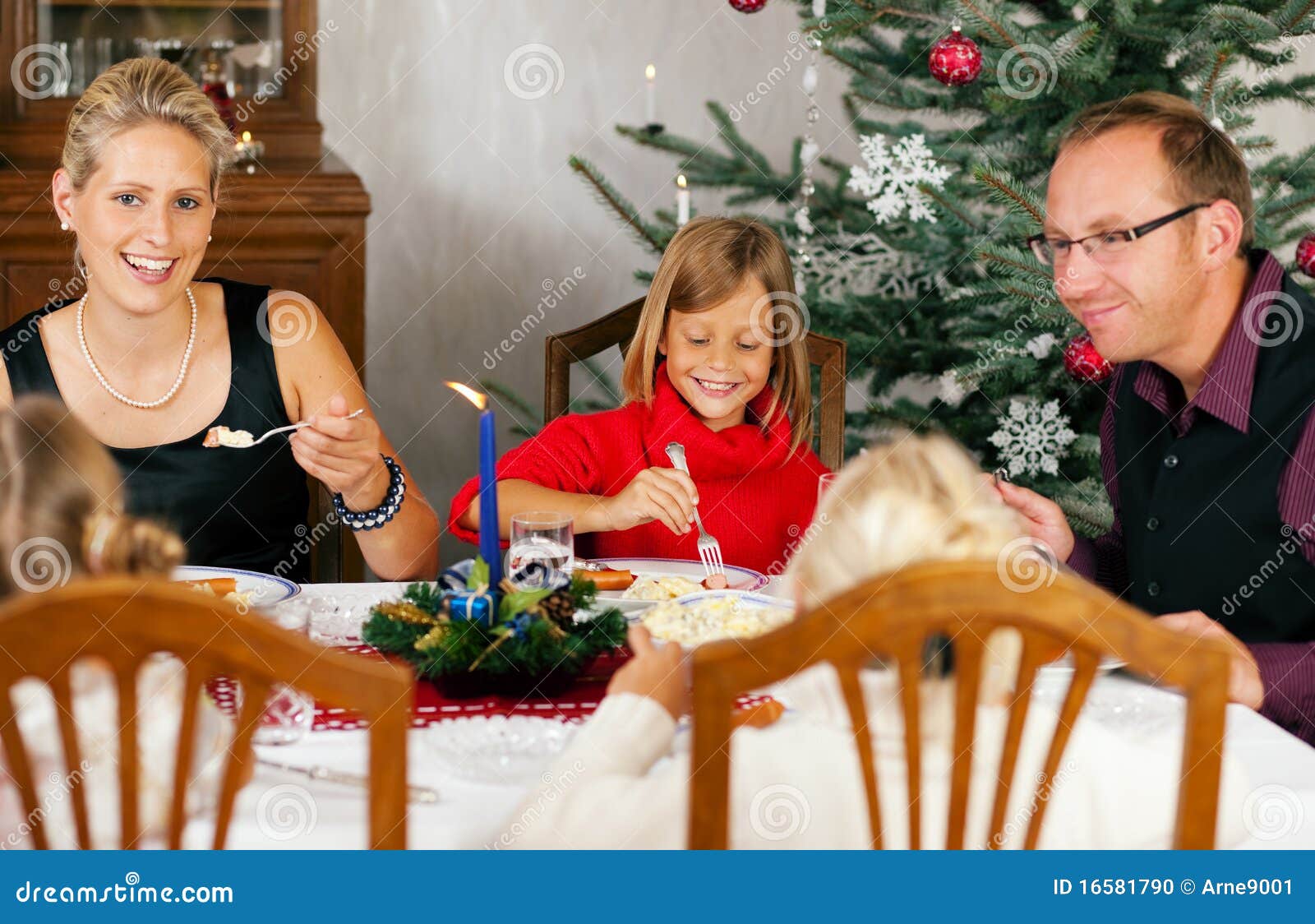 Family Having Christmas Dinner Stock Photo Image of potato, candle