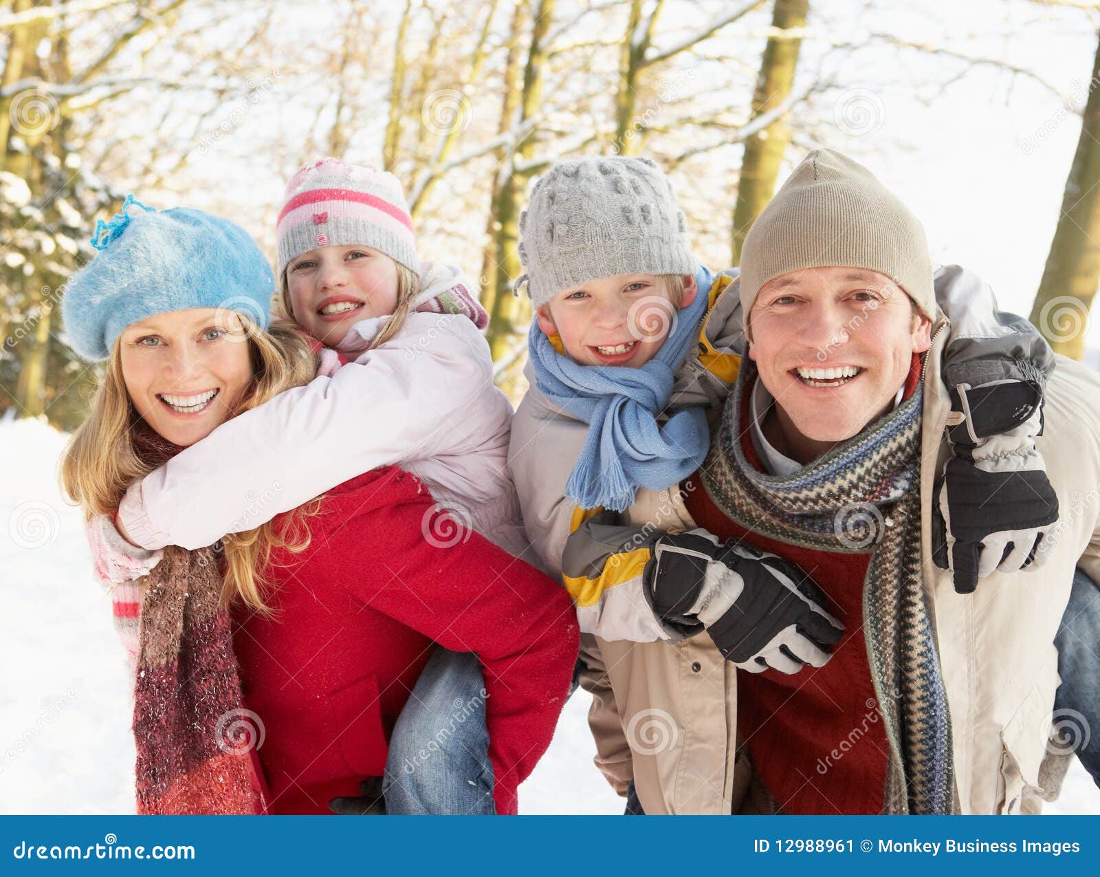 Family Having Fun Snowy Woodland Smiling