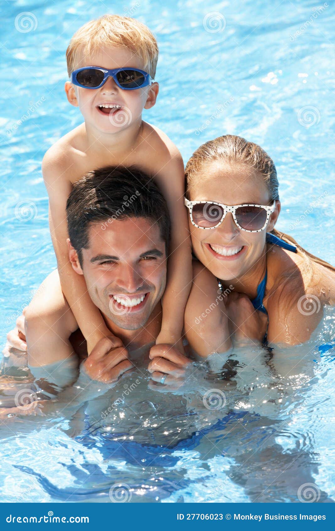 family having fun in swimming pool