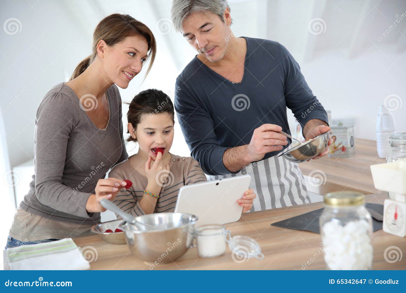 Family in Kitchen Baking Pastries Together Stock Image - Image of