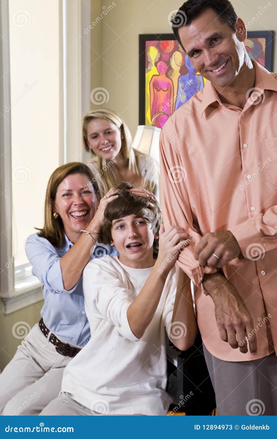 Family Laughing Together at Home, Mom Teasing Son Stock Image picture Family Laughing Together at Home, Mom Teasing Son Stock Image