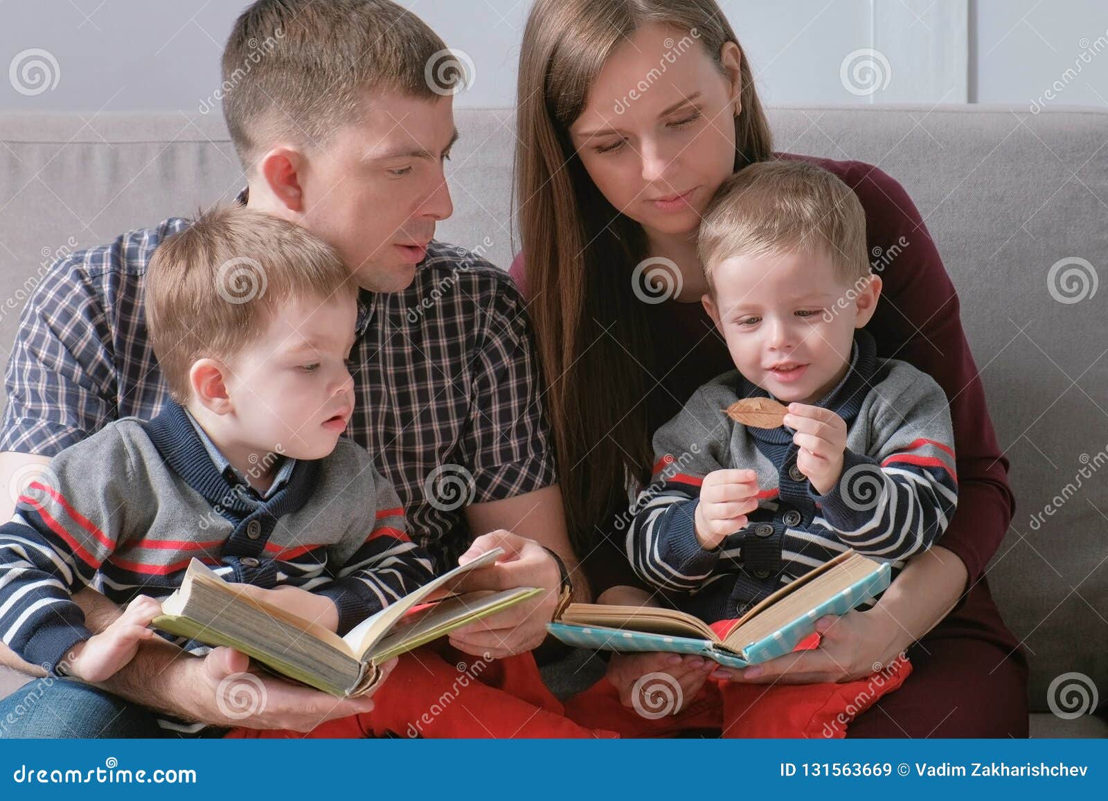 Family Mom Dad And Two Twin Brothers Read Books Sitting On The Sofa Family Reading Time Stock Image Image Of Adult Father Family Mom Dad And Two Twin Brothers Read Books Sitting On The Sofa Family Reading Time Stock Image Image Of Adult Father