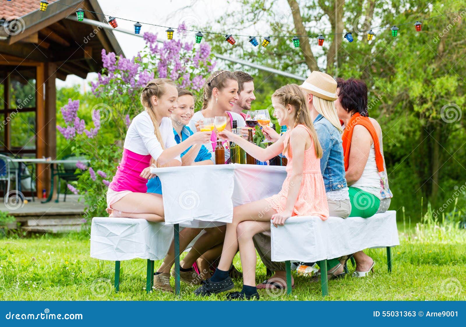 Family And Neighbors At Garden Party Drinking Stock Image Image