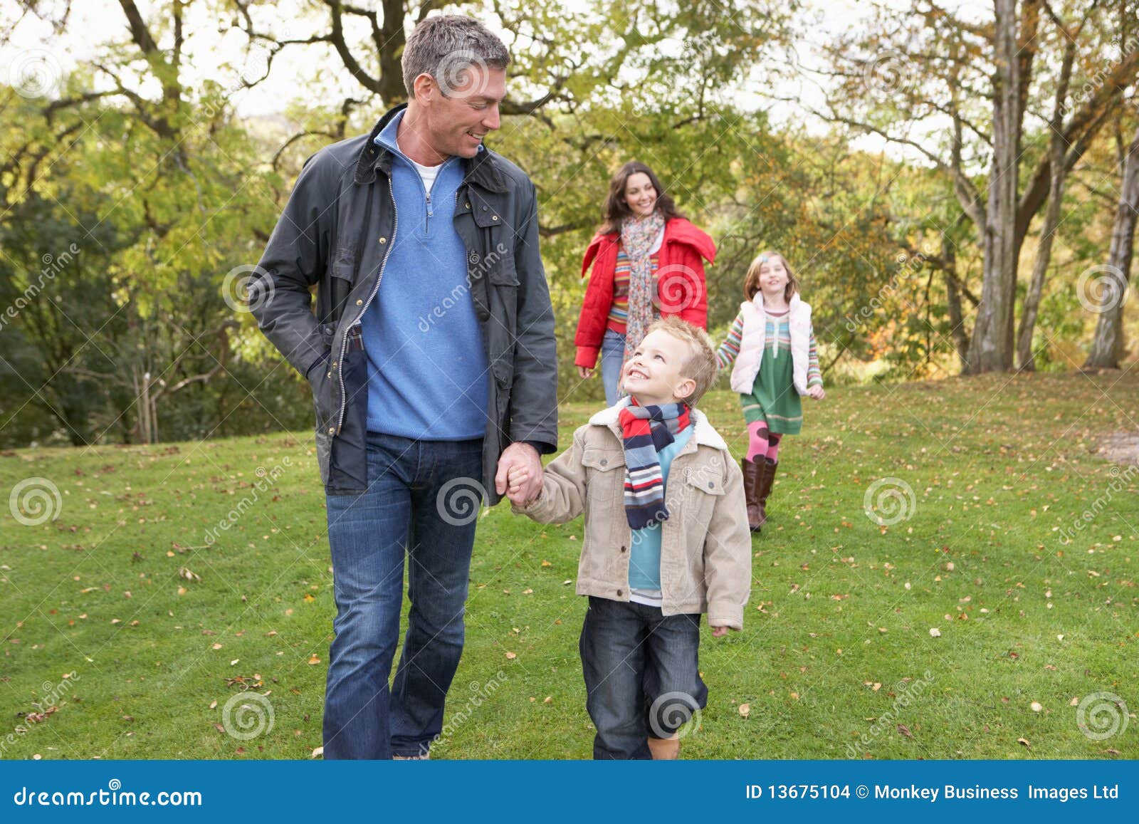 Family Outdoors Walking through Park Stock Photo Image of outdoors