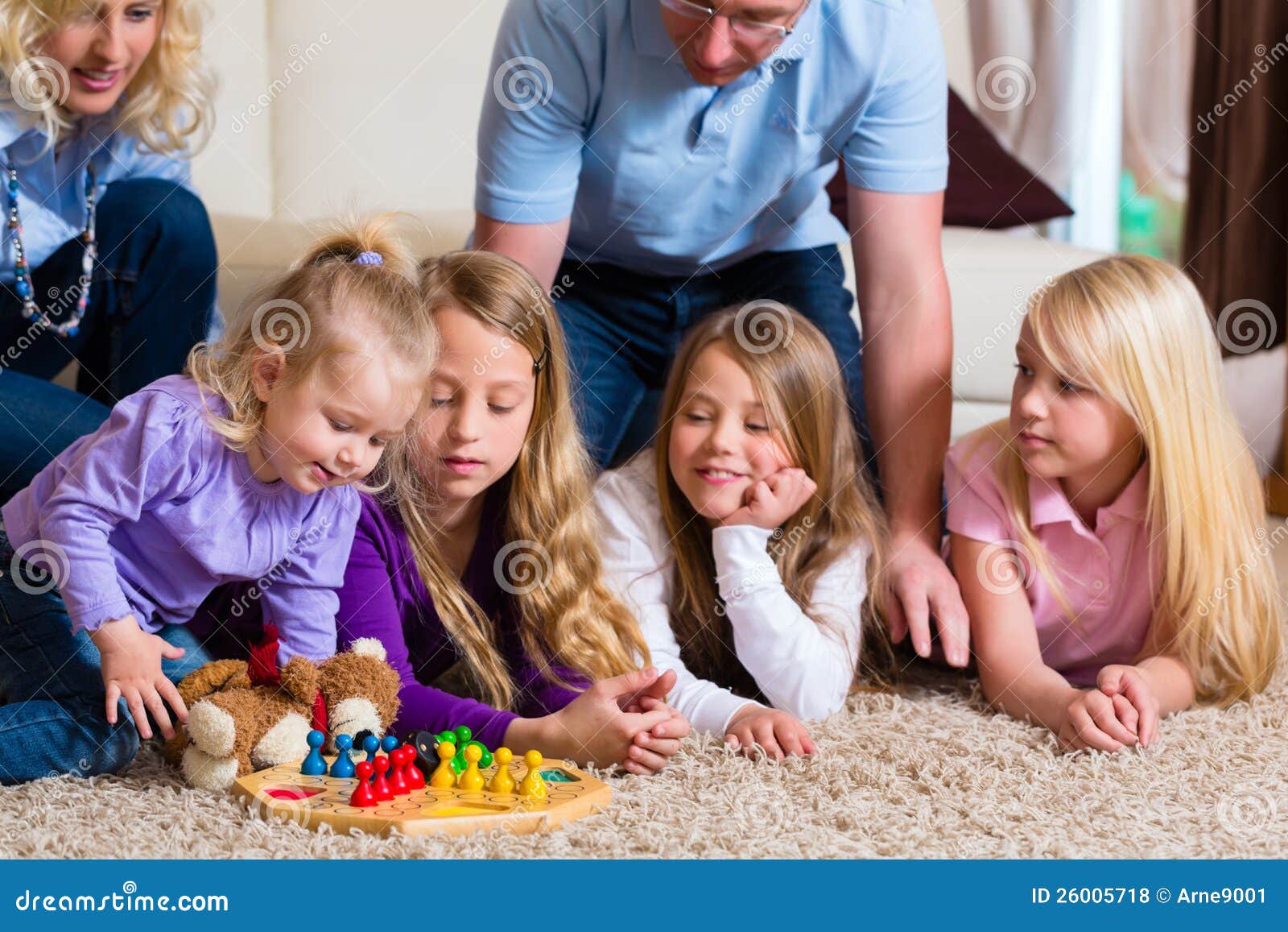 Family Playing Board Game at Home Stock Photo Image of carpet