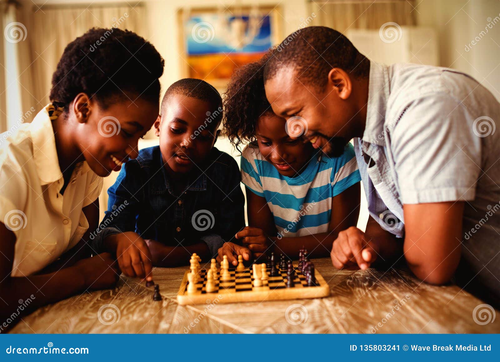 Girl and boy playing chess at home. - a Royalty Free Stock Photo from  Photocase