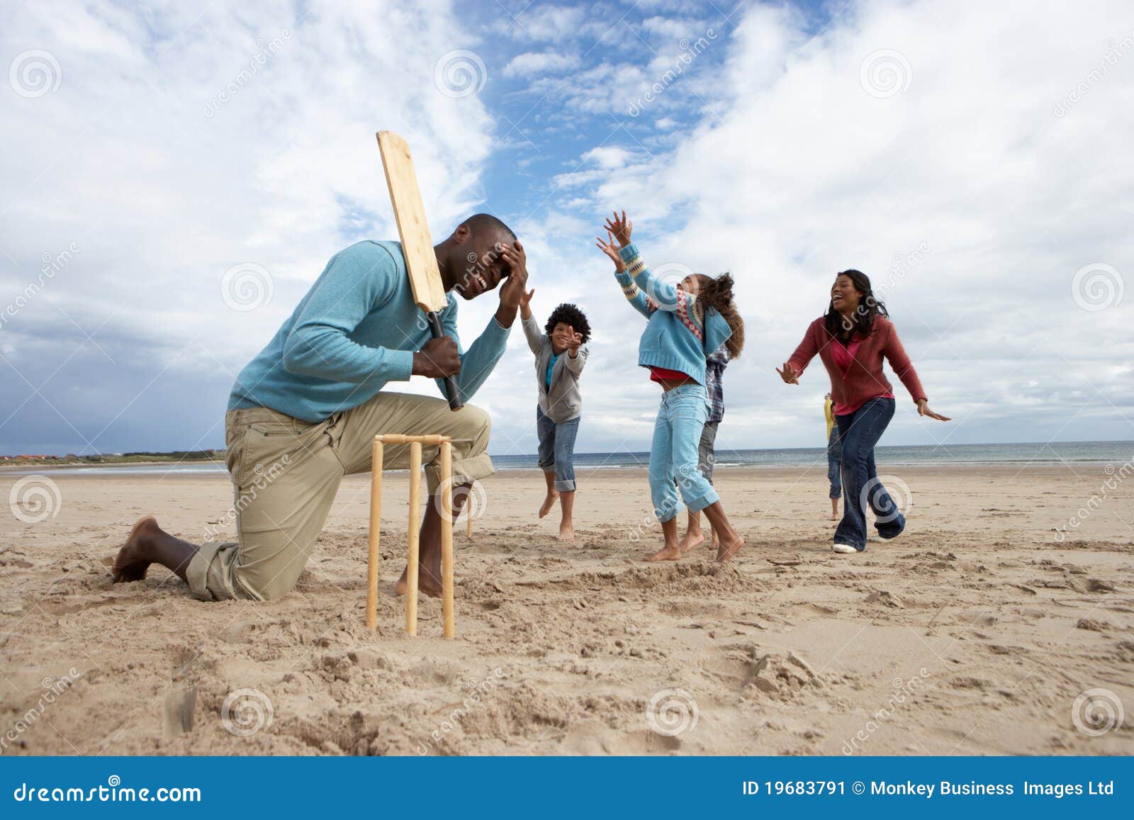 Family Playing Cricket on Beach Stock Image Image of sandy, happy