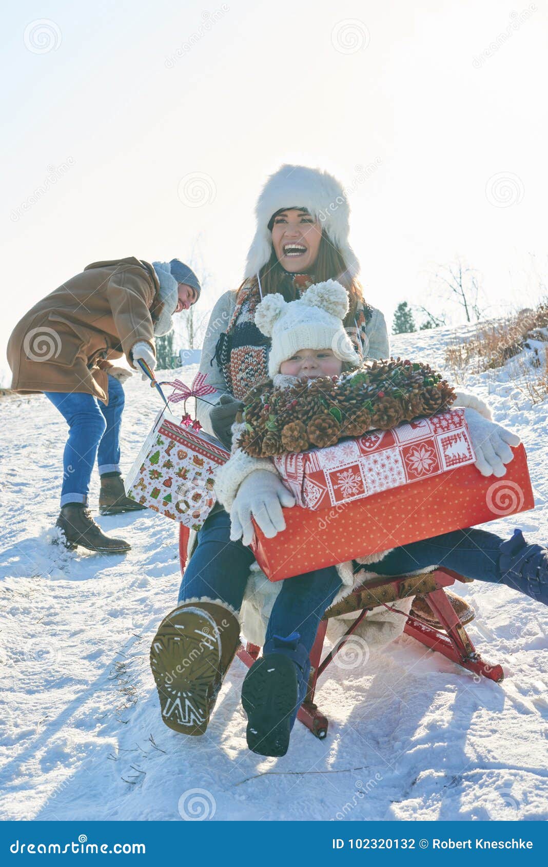 Download Family playing with sled stock photo Image of parents