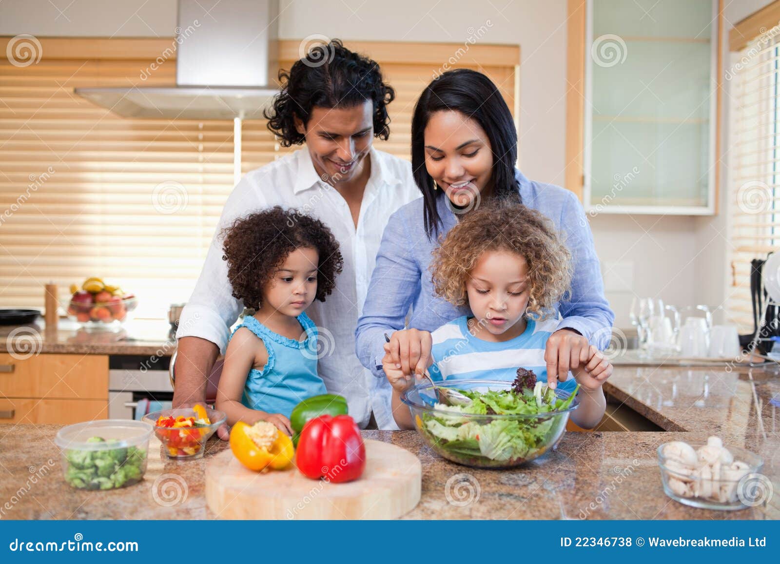 Family Preparing Salad Together in the Kitchen Stock Photo Image of
