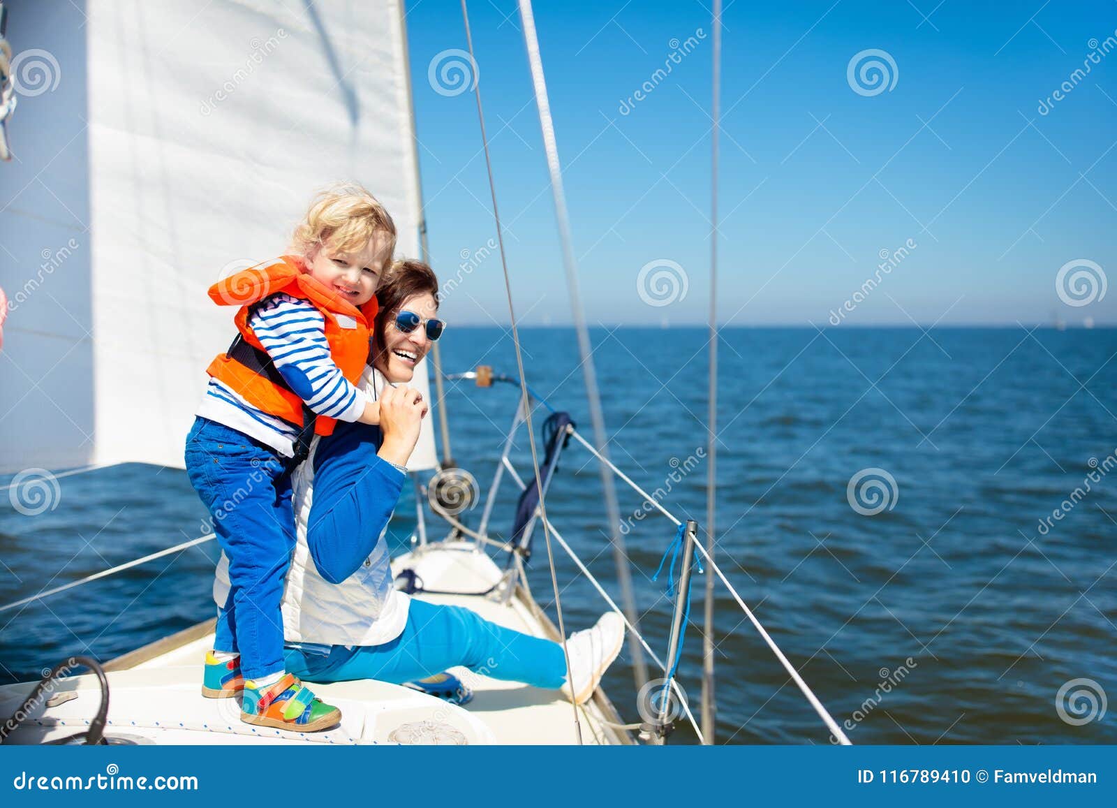 family sailing. mother and child on sea sail yacht.