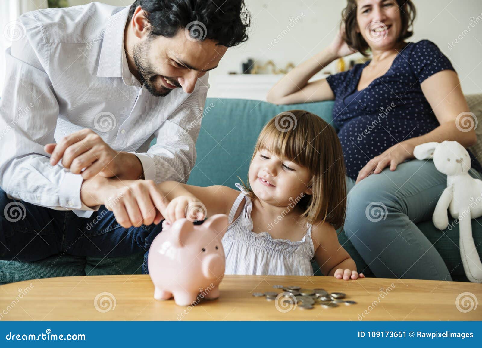 Family Saving Money in Piggy Bank Stock Image - Image of finance