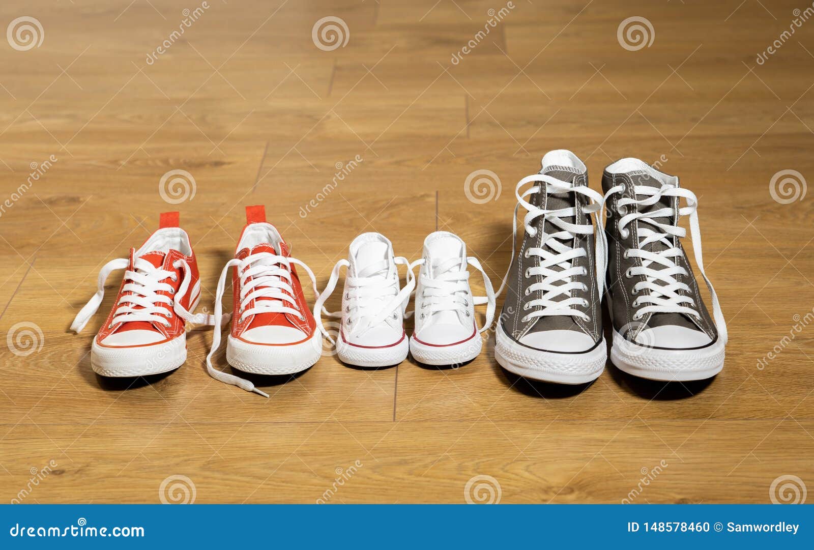 Family Sneakers Canvas Shoes Parents and Child on Wood Floor at Home in ...