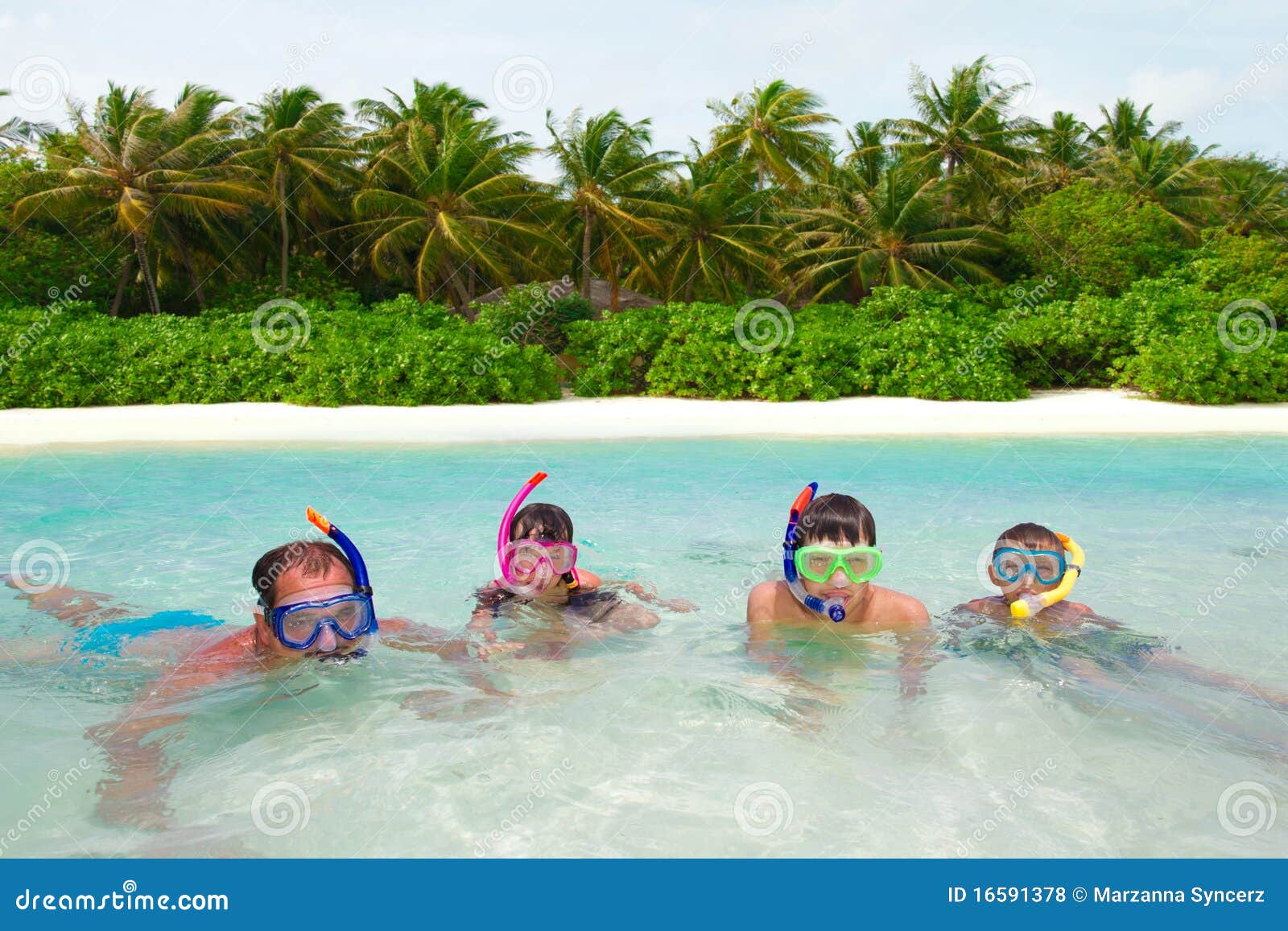 Family snorkeling in water stock photo. Image of snorkel 16591378