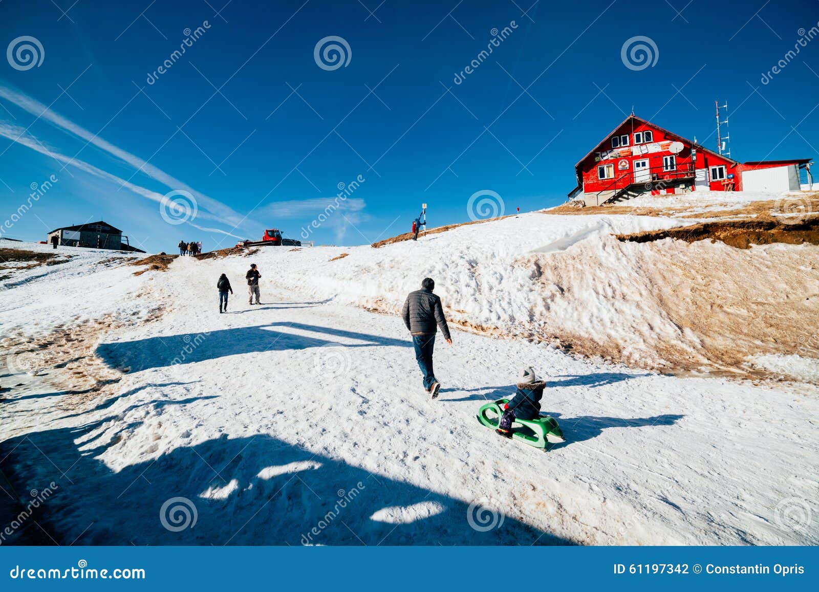 family in snow at cota 2000 sinaia