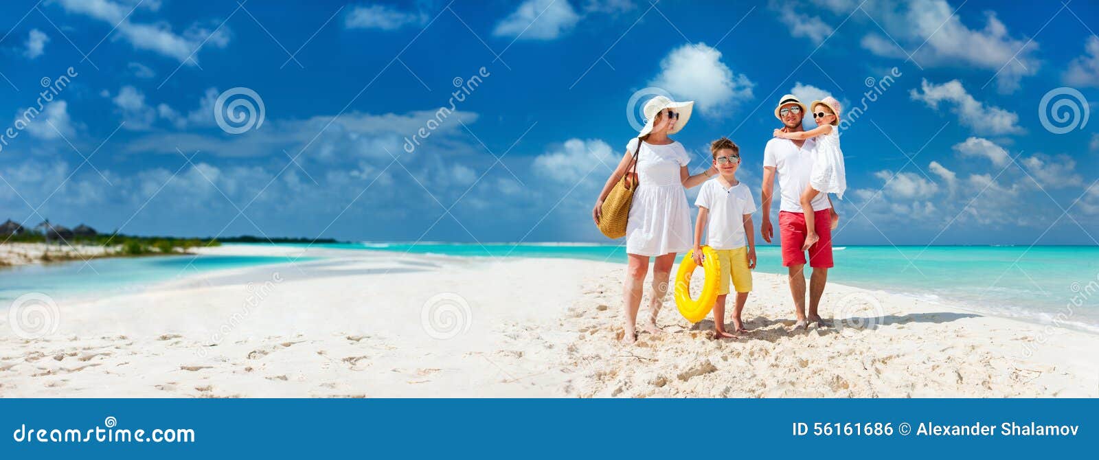 family on a tropical beach vacation