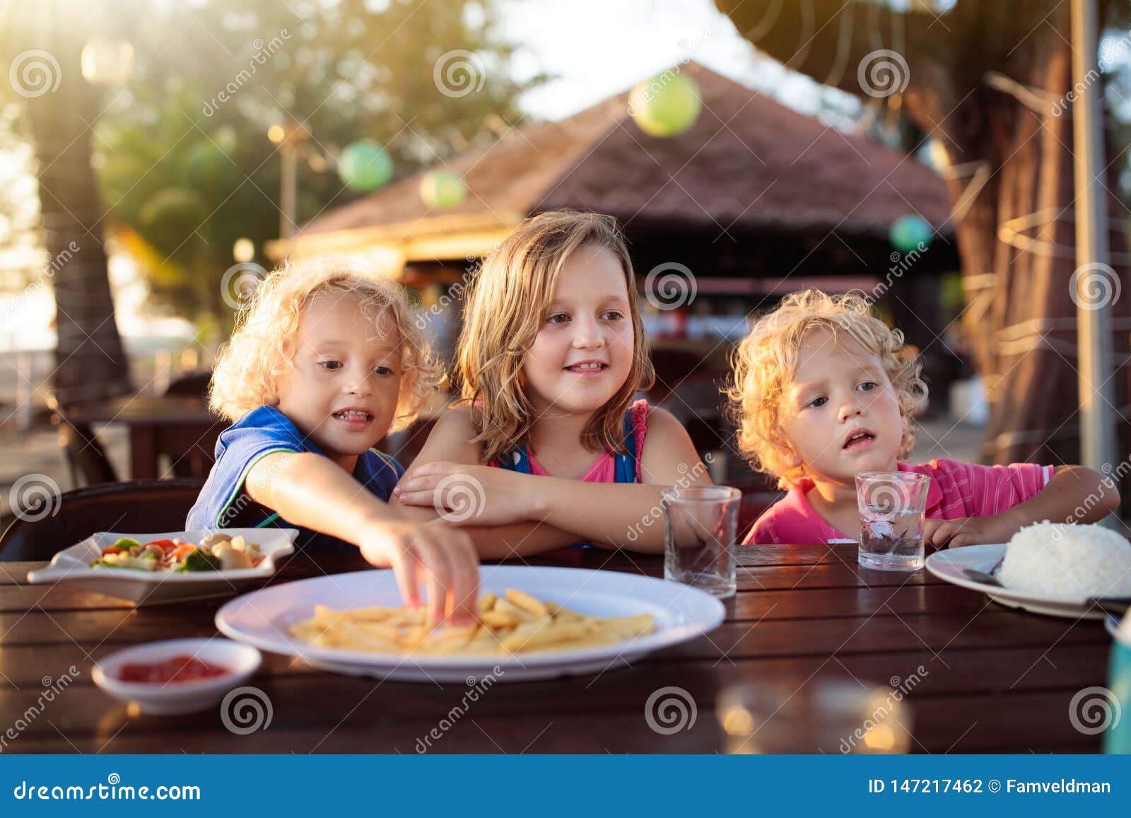 Family Vacation Lunch. Kids in Beach Restaurant Stock Photo - Image of