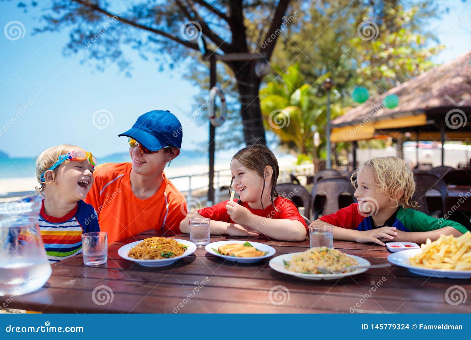 Family Vacation Lunch. Kids in Beach Restaurant Stock Photo - Image of