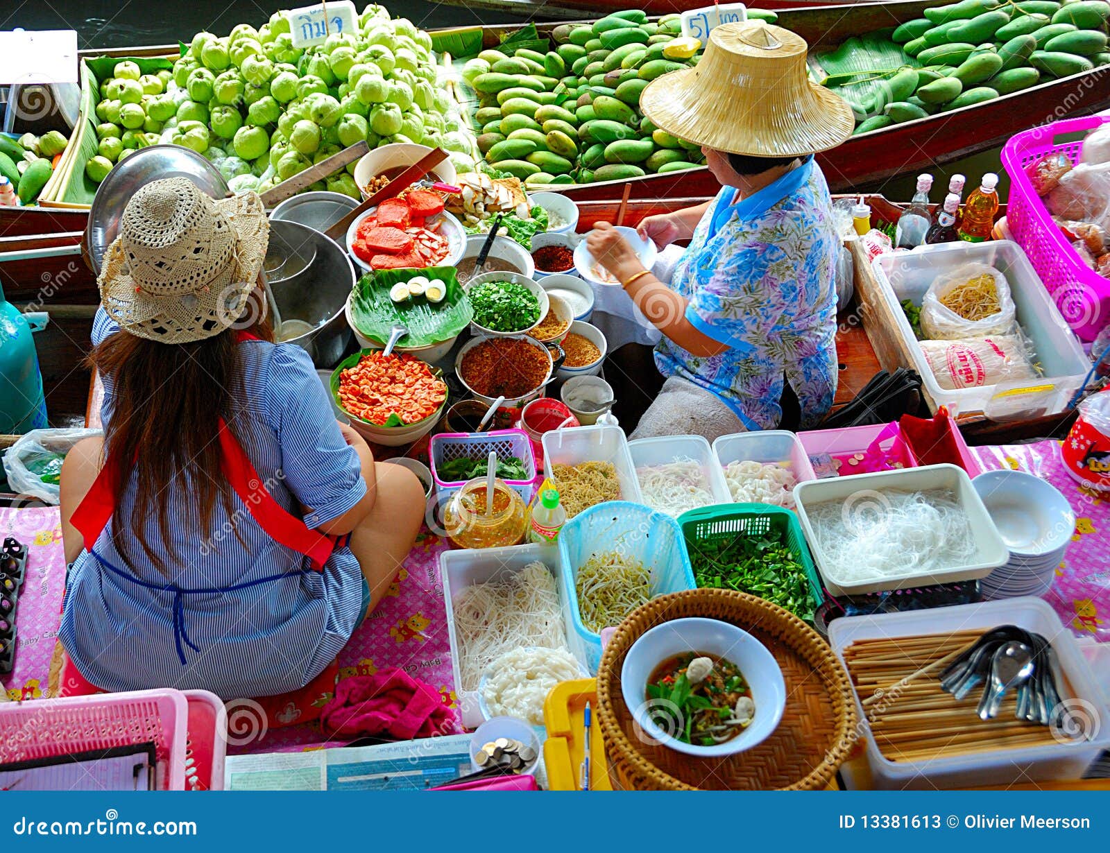 Famous food market. The floating market close to bangkok is a very colorfull and famous market in the world. this picture shows the traditional food and fruit and vegetables you can find there.