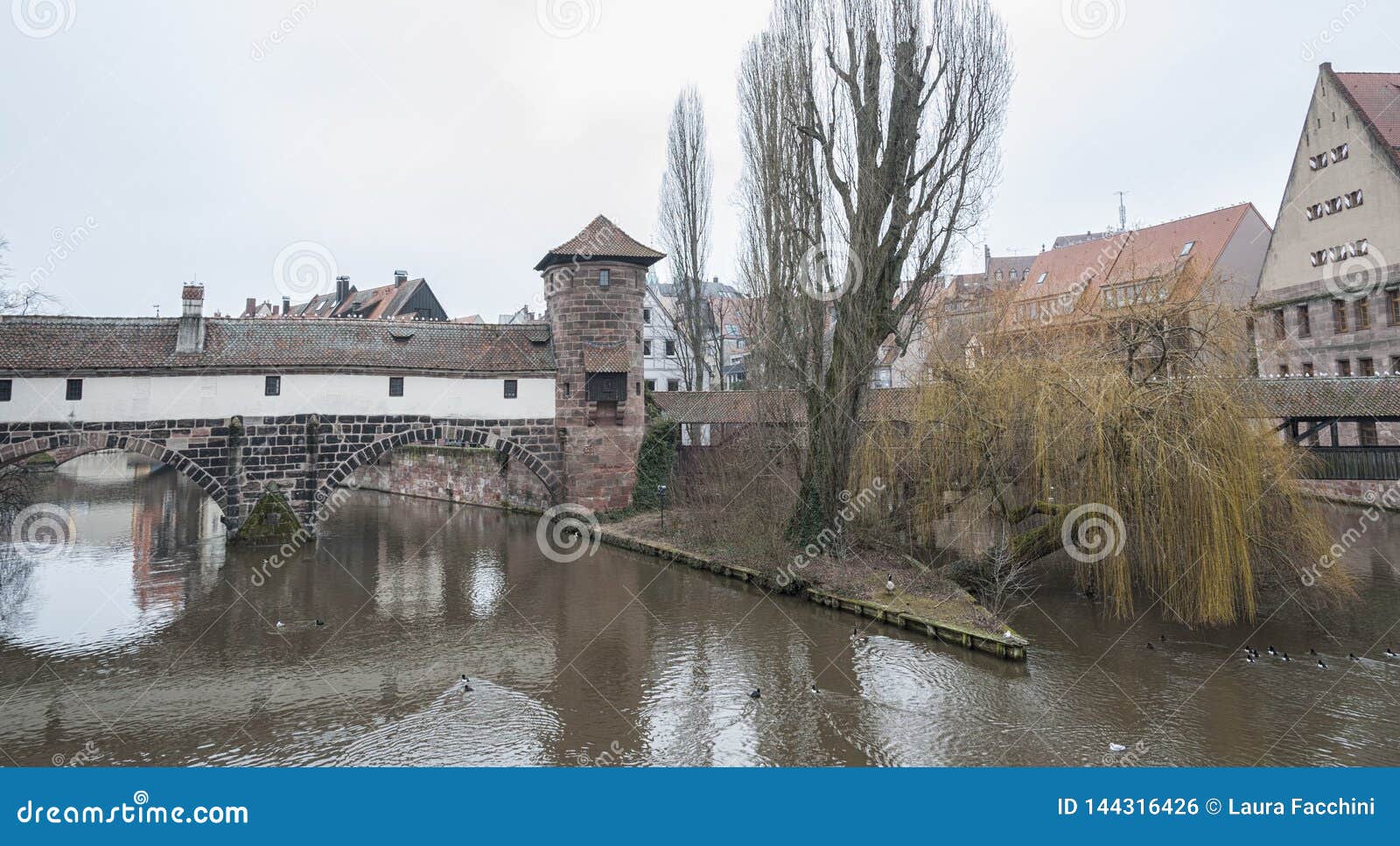 the famous former wine depot weinstadel and water tower wasserturm over the river pegnitz and  henkersteg and henkerhaus
