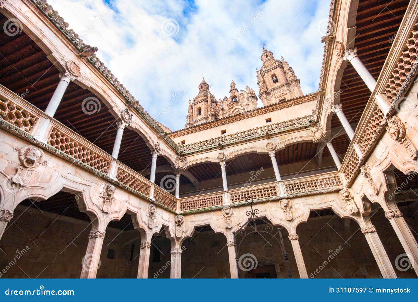 famous patio de la casa de las conchas with la clerecia church in salamanca, castilla y leon, spain