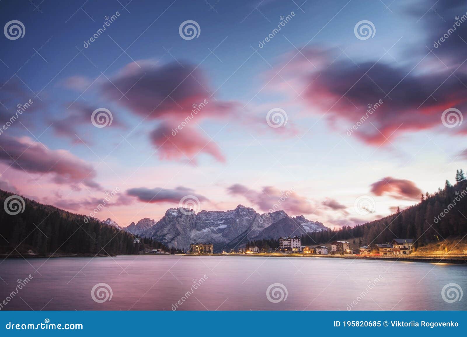 famous tourist place lake lago di misurina on sunset. picture with long e[posure and amazing dramatic sky
