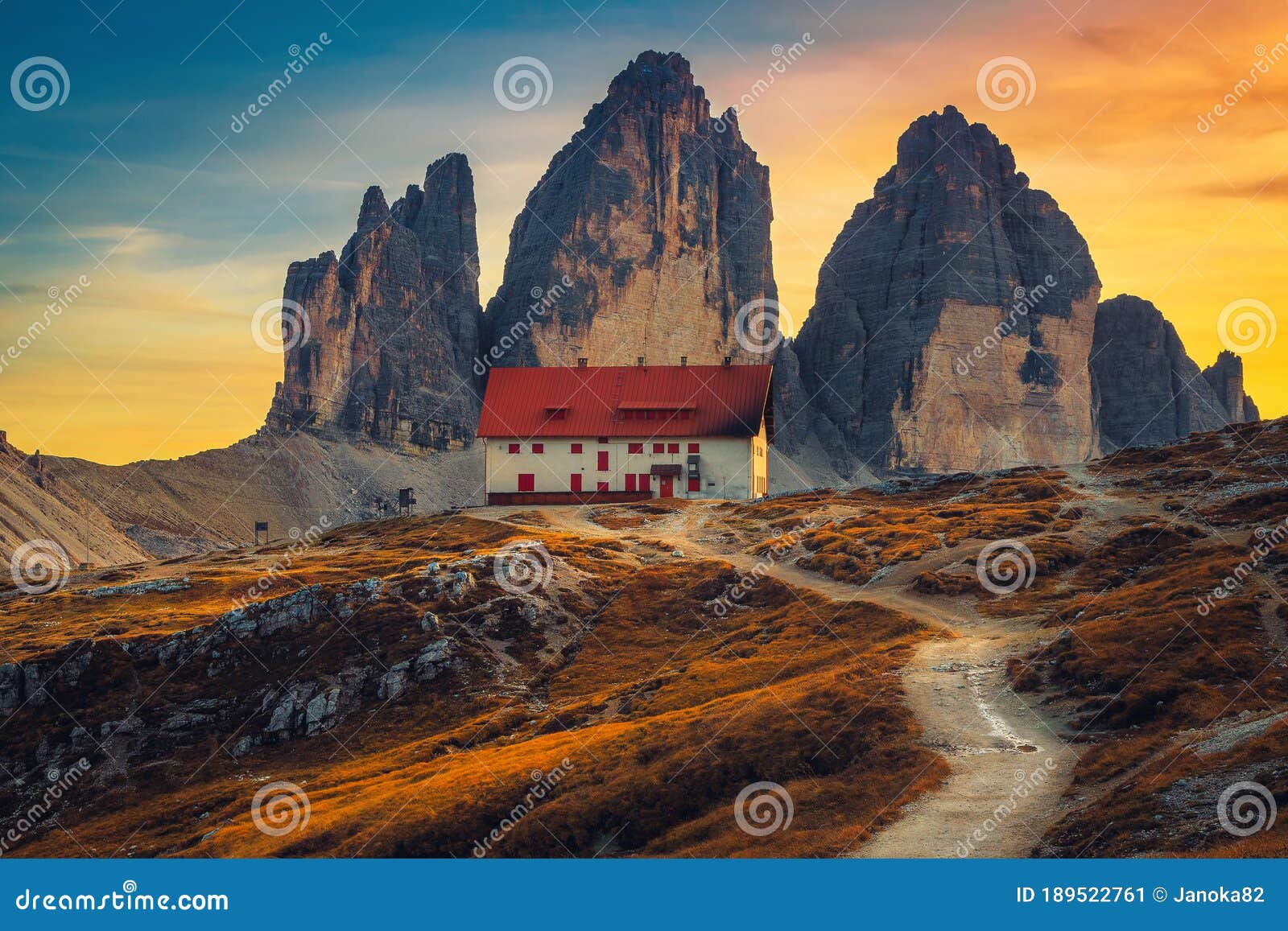 famous tre cime di lavaredo peaks at sunset, dolomites, italy